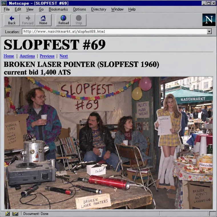 Grey 1995 auction web page in Times: a blurry photo of a broken red lamp, 'SLOPFEST #69 LOT: BROKEN LASER POINTER, bid 1,400 ATS'